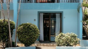 A two-story building with a balcony, a door with curtains, and a number '10' on the wall. - Villa Riviera in Coco Beach (Coco)