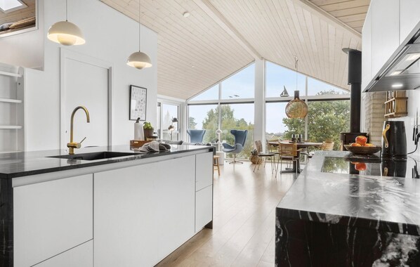 Fridge, stovetop, dishwasher, coffee/tea maker