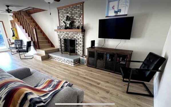 Smart TV, fireplace, table football, books