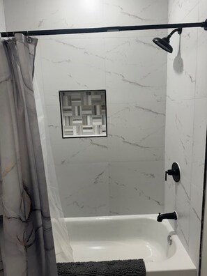 Shower, hair dryer, towels, soap