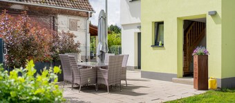 Appartement "Wohnung Erdgeschoss" avec terrasse privée et Wi-Fi