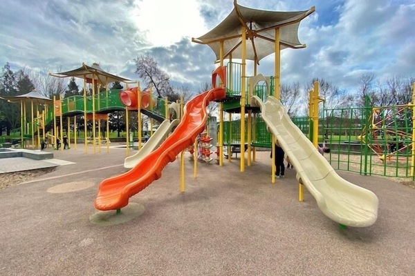 Let kids burn energy at a colorful playground close by.
