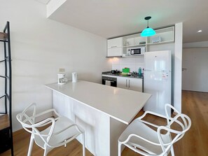 Fridge, microwave, stovetop, coffee/tea maker