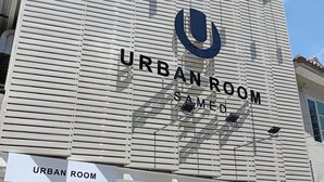 A building with a sign reading "URBAN ROOM" and "SAME" indicating a hotel or accommodation. - Urban Room Samed (Rayong)