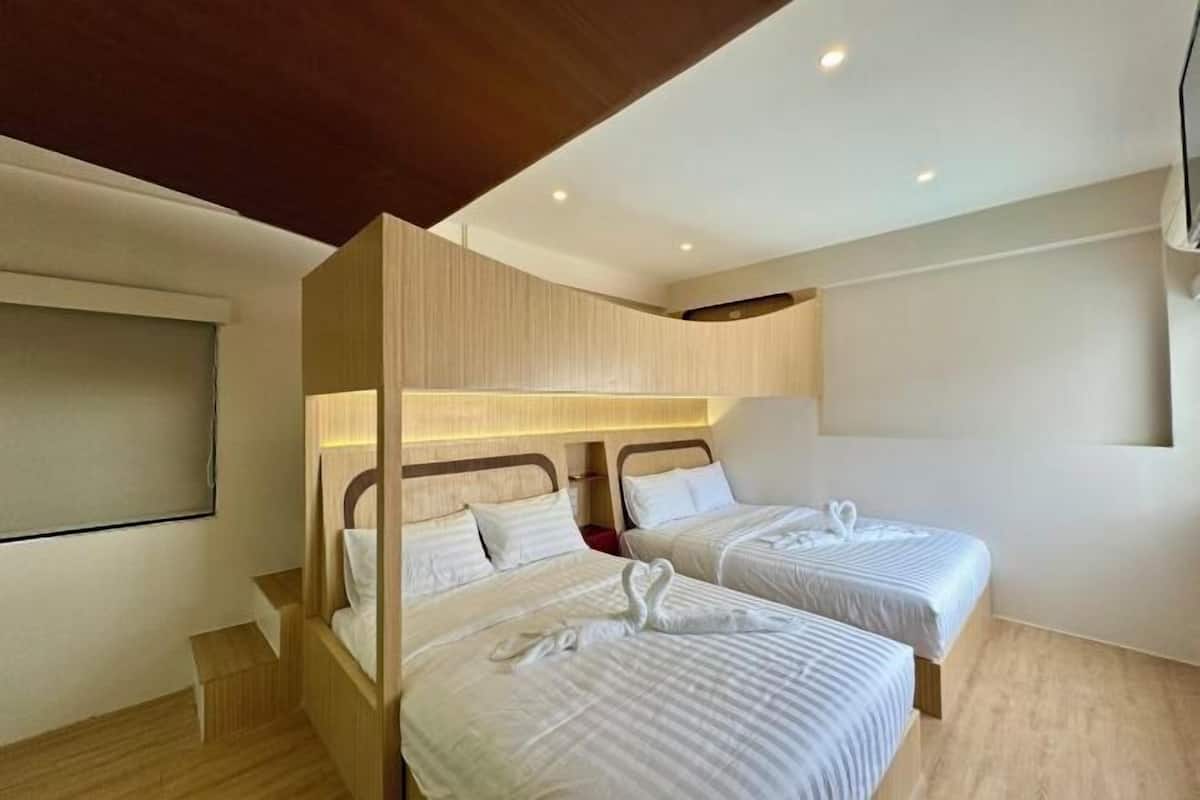 Roba de llit hipoal·lergògena, minibar i cortines opaques