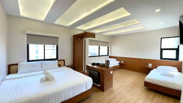 Executive kamer | Hypoallergeen beddengoed, een minibar, verduisterende gordijnen