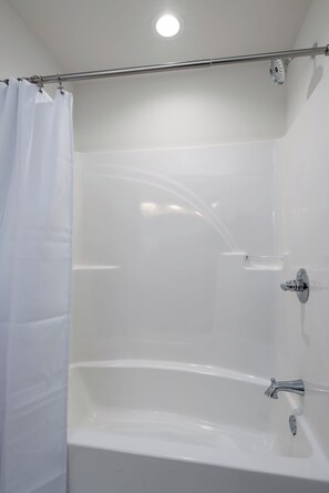 Shower, hair dryer, towels, shampoo