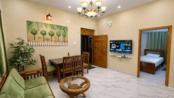 Family Apartment, 2 Bedrooms, Balcony, City View | Living area | Flat-screen TV