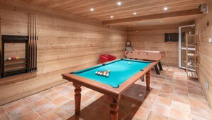 A wooden-floored room with a pool table, a foosball table, and a dartboard. - 178m2 Chalet in Alpe d'Huez Ski-in/Ski-out with Terrace (Huez)