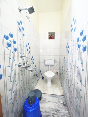 Shower, rainfall showerhead, towels, soap - Goroomgo Anandam Home Stay Rishikesh (Rishikesh)