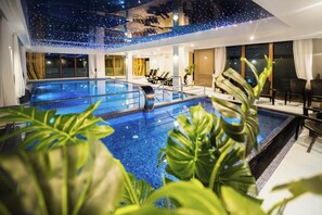 Indoor pool, open 10:00 AM to 6:00 PM, pool loungers