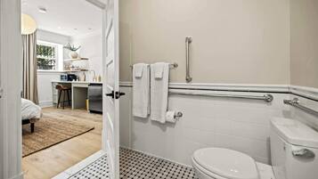 Shower, hair dryer, towels, shampoo