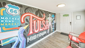 A mural with the text "Tulsa, MidTown" and "Mother Road Market" on a wall. - Walk to Expo Square Pavilion: Updated Tulsa Home! (Tulsa)
