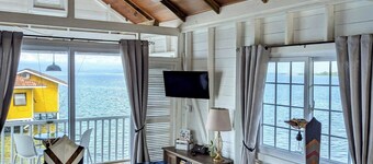 Charming bungalow over a coral reef in the Caribbean sea with stunning sunsets! 
