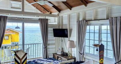Charming bungalow over a coral reef in the Caribbean sea with stunning sunsets!
