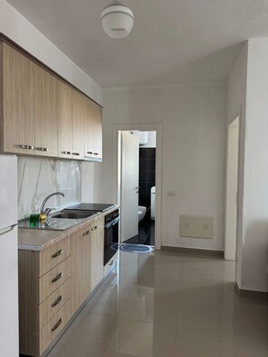 Apartment, 1 Bedroom, Balcony, City View | Private kitchen | Fridge, oven, stovetop, electric kettle