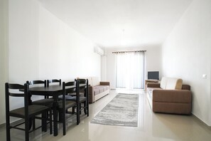 Apartment, 1 Bedroom, Balcony, City View | Living area | 40-cm flat-screen TV with cable channels - Kalpazo Golemi Plus Apartments (Golem)