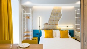 A hotel room with a bed, a bedside table, a chair, a wardrobe, and a staircase. - Tribunali Trendy Studio by Wonderful Italy (Napoli)