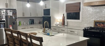 Escape to Serenity: Cozy Ranch Style Home with Charming Wrap-Around Porch. 