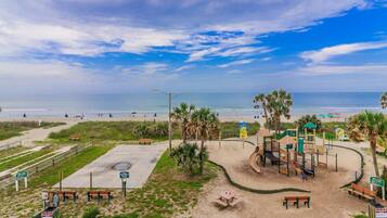 On the beach, sun loungers, beach towels