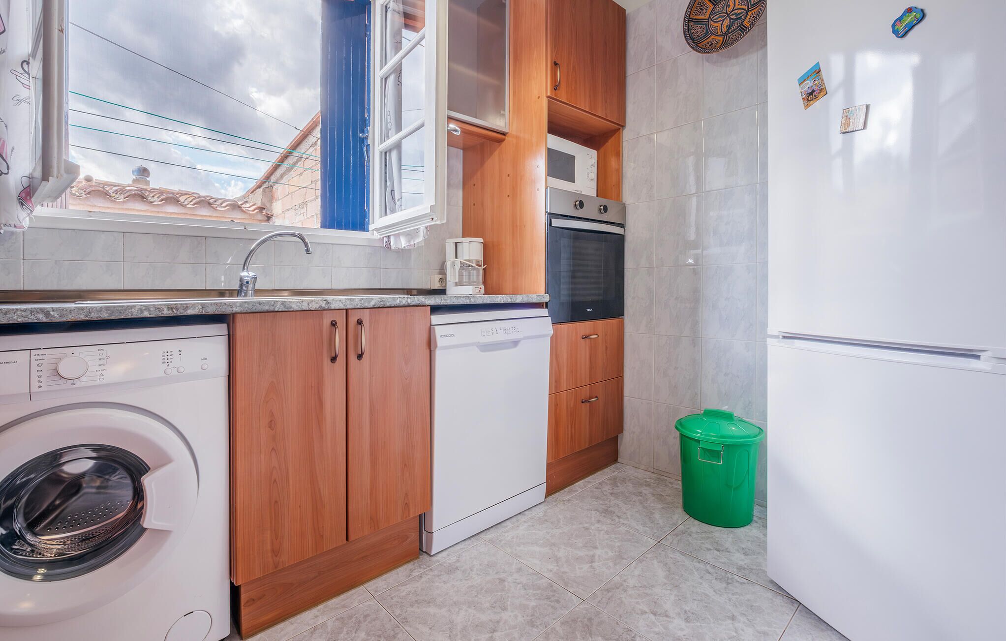 Fridge, stovetop, dishwasher, coffee/tea maker