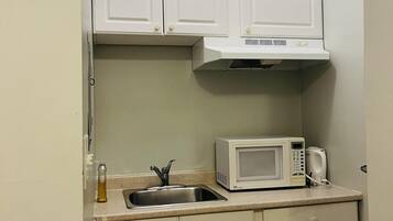 Fridge, microwave, cookware/dishes/utensils
