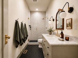 Shower, eco-friendly toiletries, hair dryer, towels
