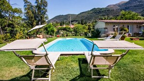 A rectangular swimming pool with two lounge chairs on each side. - Pet friendly home in Camaiore (Camaiore)