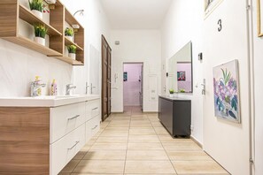 Shower, hair dryer, towels, soap