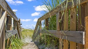 A wooden boardwalk leading to a beach with a clear sky. - Oceanfront Oasis w BBQ Pet Friendly Beach Access (Saint Augusitne)