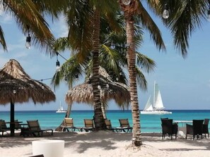 On the beach, sun loungers, beach towels