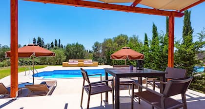 Relax at Villa Rhea, just a short walk from the beautiful Ai Helis Beach