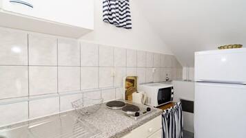 Fridge, microwave, stovetop, dining tables