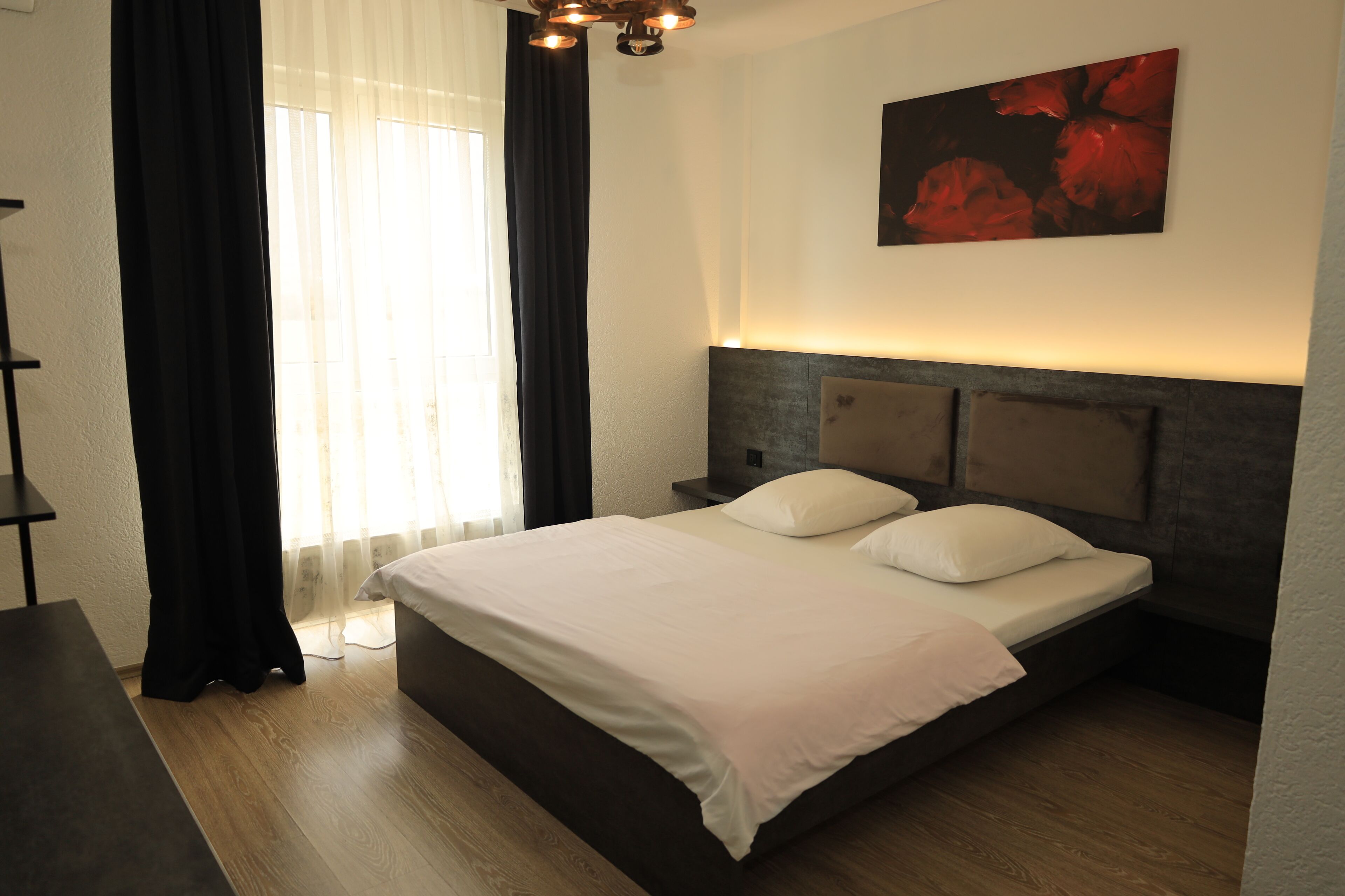 Desk, laptop workspace, blackout drapes, iron/ironing board