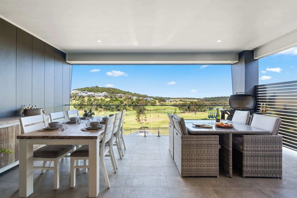 Enjoy outdoor living on this spacious balcony, perfect for BBQs!