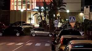 A hotel named PEZ ESPADA with a modern design, featuring a cylindrical tower and a flat facade with illuminated signage.