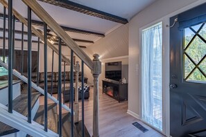 TV, fireplace, books