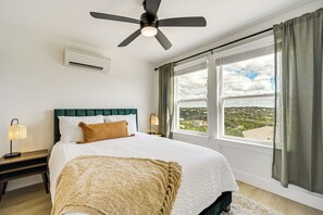Relax in comfort with a large bed and city views from the window.