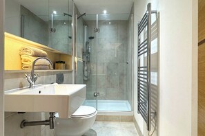 Shower, hair dryer, towels, soap