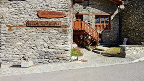 A stone building with wooden signage indicating 'Pa Pastoral' and 'ESPACE MULTIMEDIA.' - Apartment 'Les Gentianes' with Mountain View and Wi-Fi (Val-Cenis)