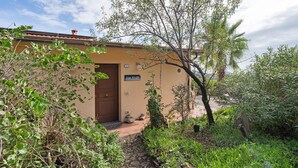 A building labeled 'Casa Bilger' with a stone pathway leading to the entrance, surrounded by greenery and trees. - Holiday Home 'Casa Bilger' with Sea View, Private Terrace and Wi-Fi (Dolcedo)