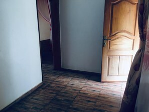 Economy Room, Balcony, Lake View | Desk, laptop workspace, bed sheets