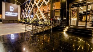 A modern building with a prominent geometric facade and a sign reading "White Diamond." - White Diamond Hotel Sari (Jeddah)