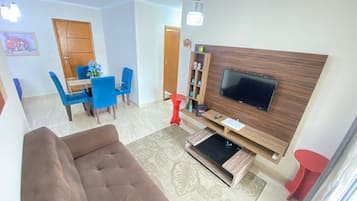 Comfort Apartment | Living area | 50-inch flat-screen TV with satellite channels, TV
