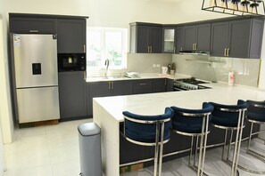 Fridge, microwave, oven, stovetop - Elegant 3 BR, 2 BR Home in a Gated Complex with shared Pool. Near Falls, Beaches (Saint Ann's Bay)