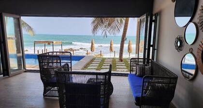 3-bedroom luxury beach villa in serene Ghana with AC, WiFi. Enjoy relaxation