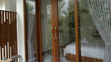 Habitación Deluxe, 1 cama King size, balcón, vista al jardín | Terraza o patio