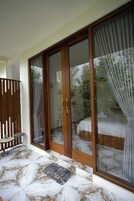 Deluxe Room, 1 King Bed, Balcony, Garden View | Terrace/patio