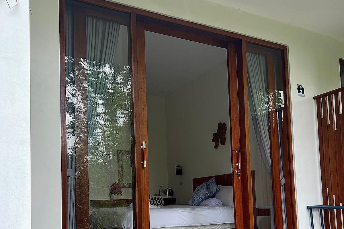 Habitación Deluxe, 1 cama King size, balcón, vista al jardín | Terraza o patio