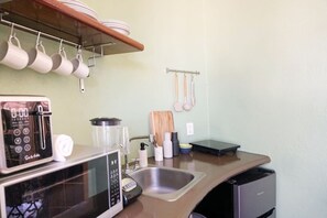 Fridge, microwave, stovetop, coffee/tea maker